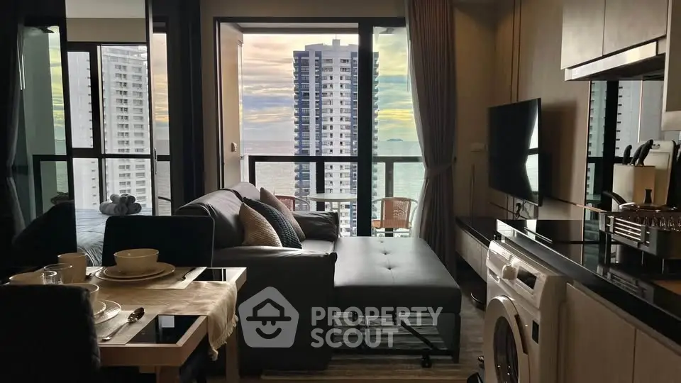 Modern living room with ocean view and stylish furnishings in high-rise apartment