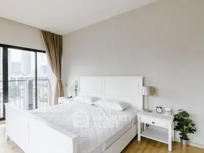 Bright and airy bedroom with city view and elegant decor