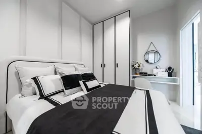 Modern bedroom with stylish decor and built-in wardrobe