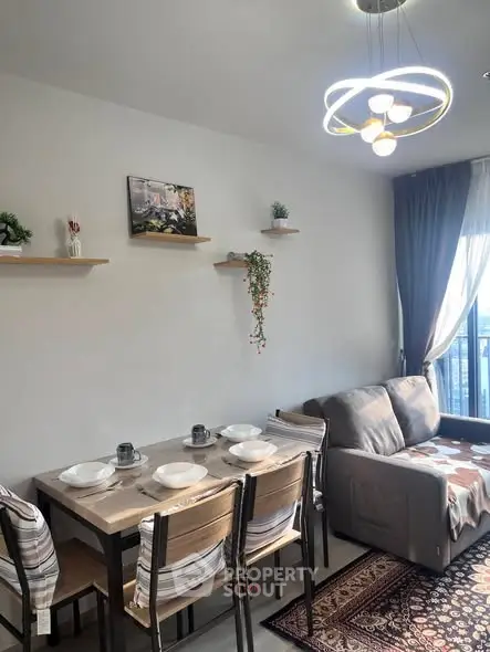 Modern living room with dining area and stylish lighting