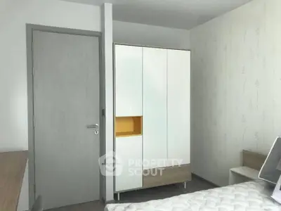 Modern bedroom with sleek wardrobe and minimalist design