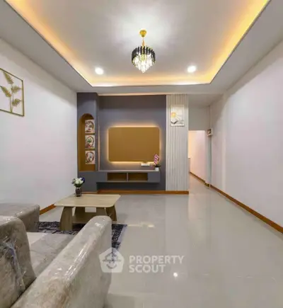 Spacious modern living room with elegant lighting and stylish decor