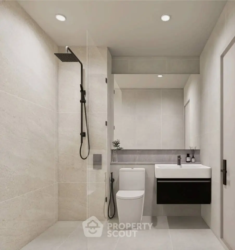 Modern bathroom with sleek fixtures and minimalist design, featuring a walk-in shower and elegant vanity.