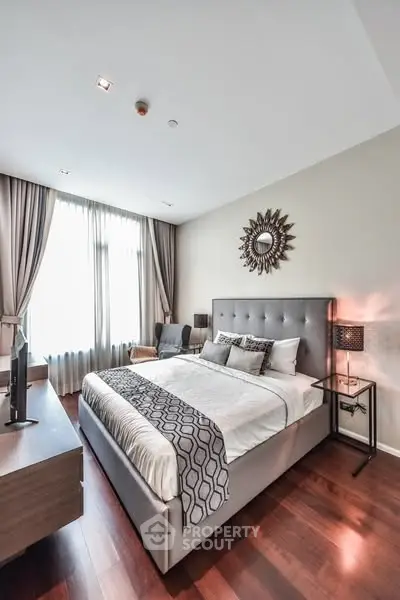 Luxurious bedroom with elegant decor and natural light