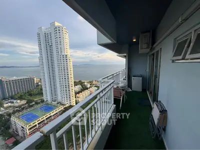 Stunning high-rise balcony with ocean view, perfect for relaxation and enjoying the cityscape.