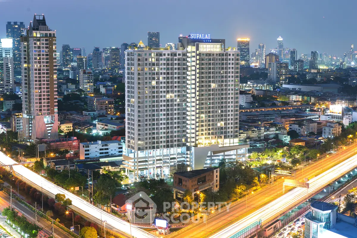 Stunning cityscape view of a modern high-rise building at dusk, showcasing vibrant urban living.