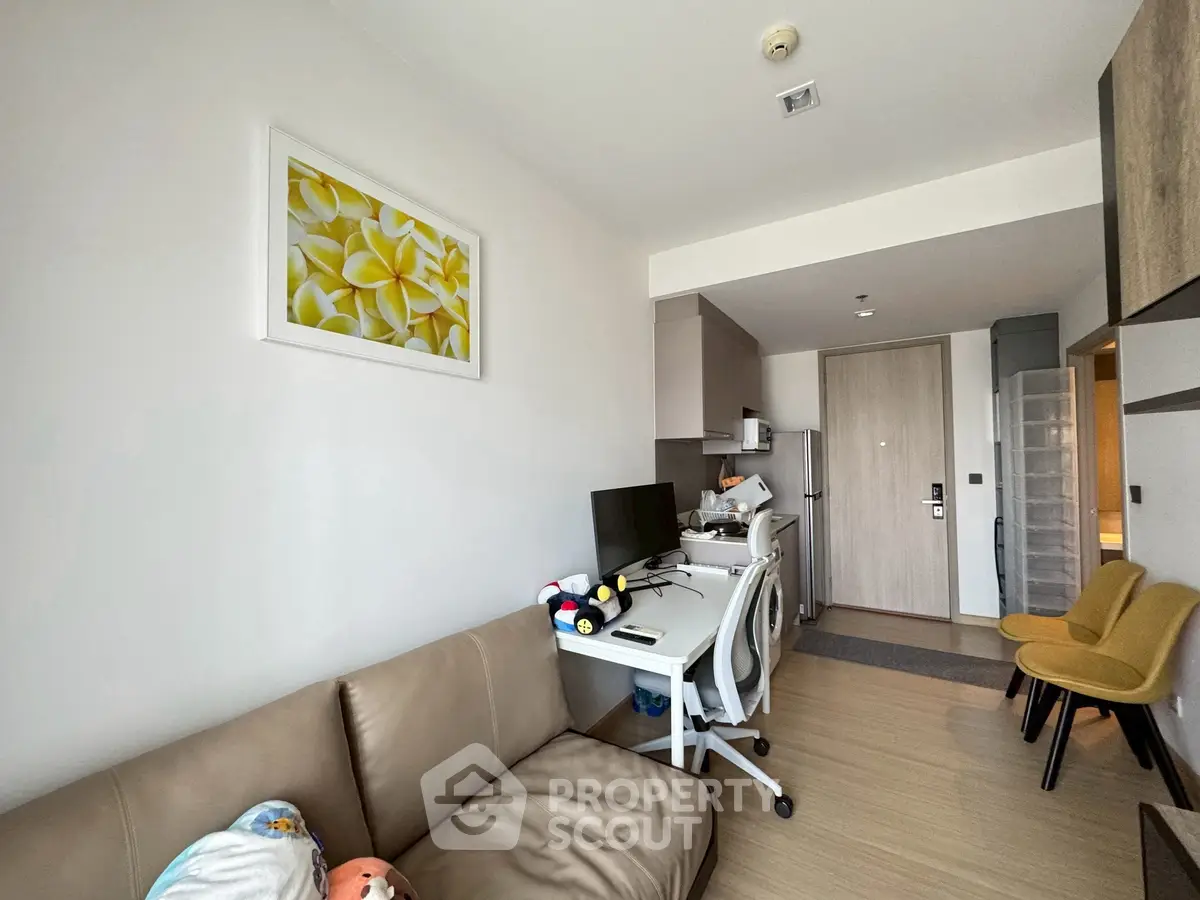 Modern apartment living room with cozy seating and workspace