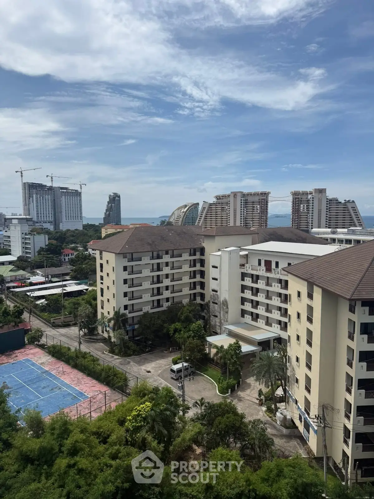 Stunning cityscape view with modern buildings and lush greenery, ideal for urban living.