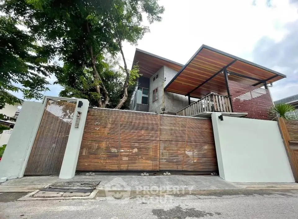 Modern architectural home with wooden accents and spacious balcony