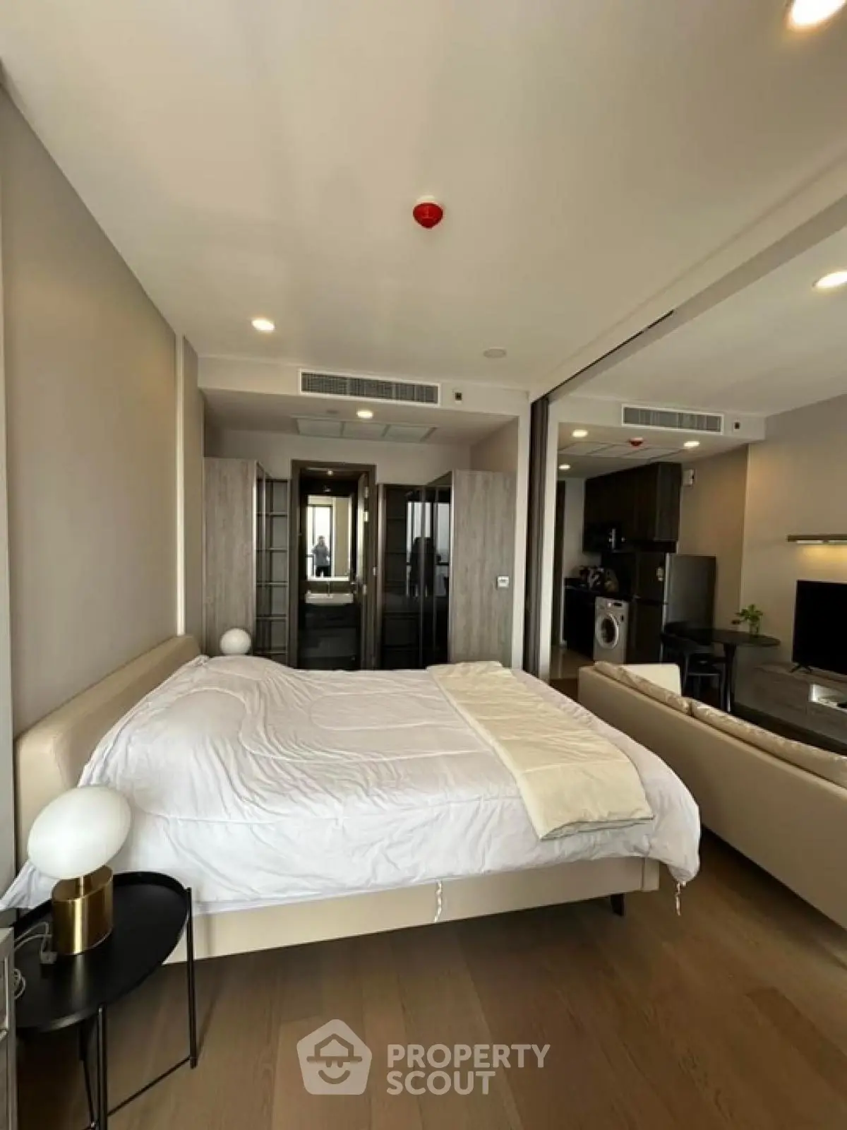 Modern studio apartment with cozy bedroom and open living area