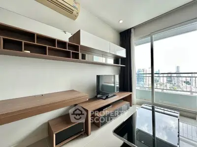 Modern living room with sleek furniture and city view from large window