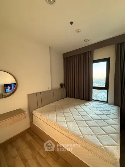 Modern bedroom with large window and stylish decor