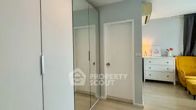 Modern bedroom with mirrored wardrobe and stylish decor