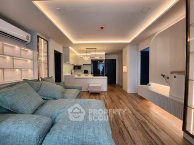 Spacious modern living room with stylish lighting and cozy furniture