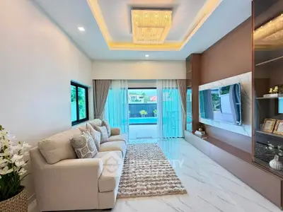 Luxurious living room with elegant decor and spacious balcony view