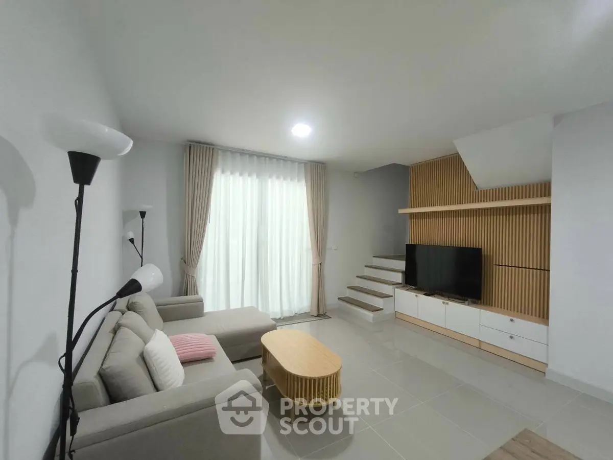 Modern living room with stylish furniture and natural light
