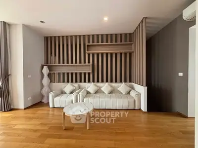 Modern living room with stylish decor and wooden flooring