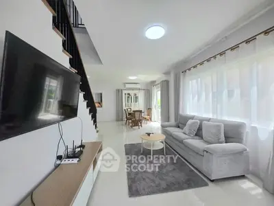 Spacious modern living room with sleek design and abundant natural light