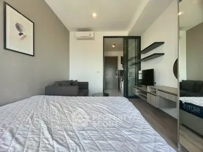 Modern bedroom with stylish decor and open layout in a contemporary apartment.