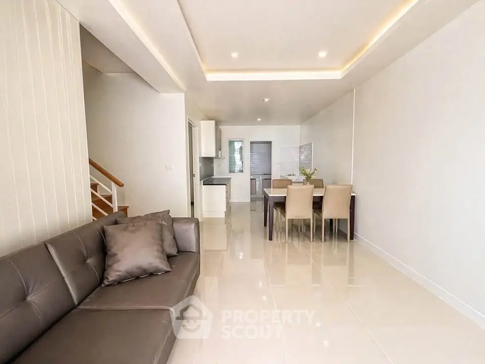 Spacious modern living room with open layout and elegant dining area