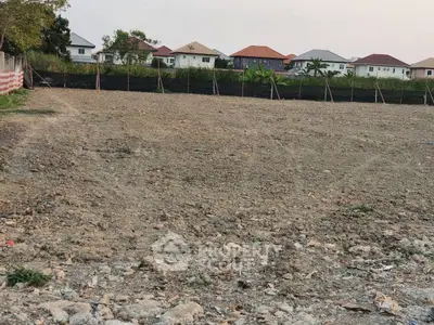 Vacant land plot with potential for residential development, surrounded by suburban homes.