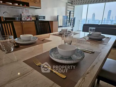 Luxurious dining setup in modern kitchen with city view