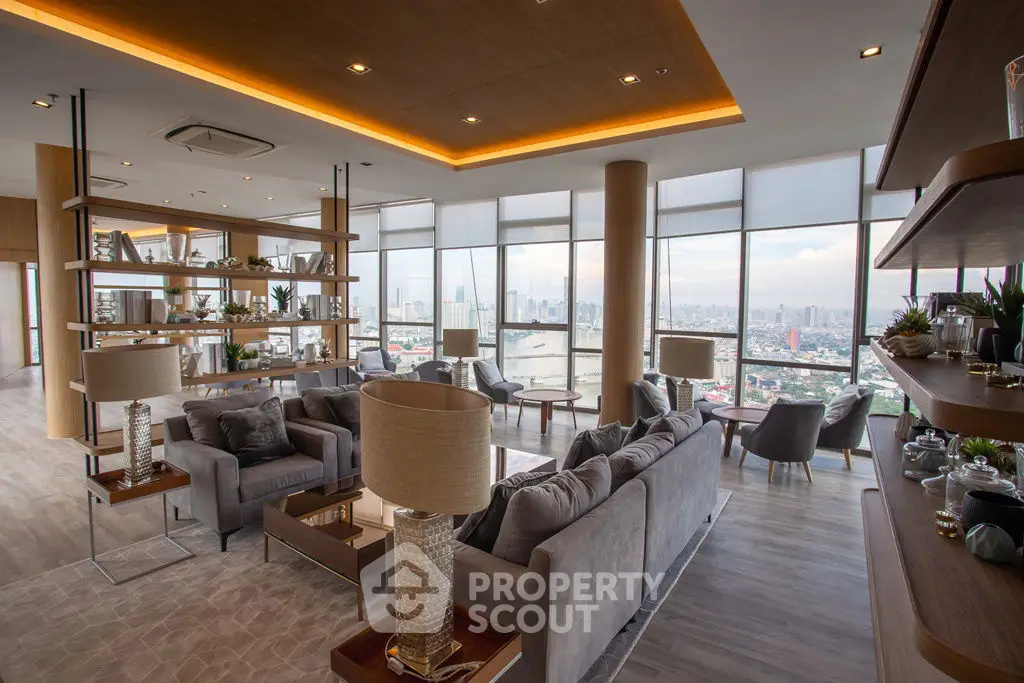 Luxurious high-rise living room with panoramic city views and elegant decor.