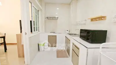 Modern kitchen with sleek appliances and open layout in a stylish apartment