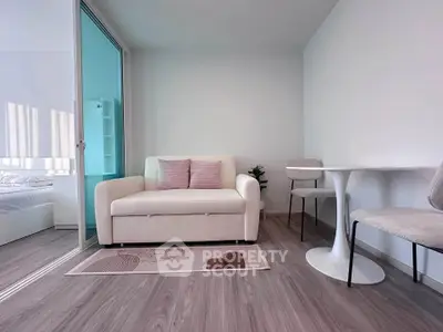 Modern living room with sleek furniture and stylish decor in a bright apartment.