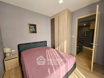 Cozy bedroom with modern decor and ample natural light