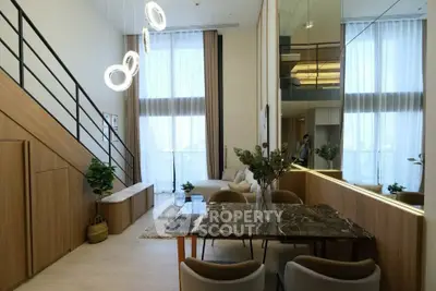Modern duplex living room with high ceilings and elegant decor