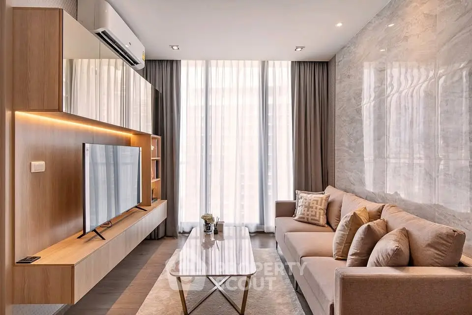 Modern living room with sleek furniture and large windows, perfect for urban living.