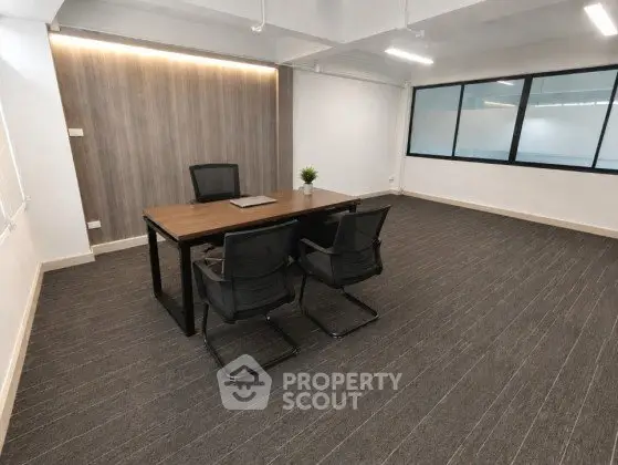 Spacious modern office with sleek design and ample natural light, perfect for productivity.