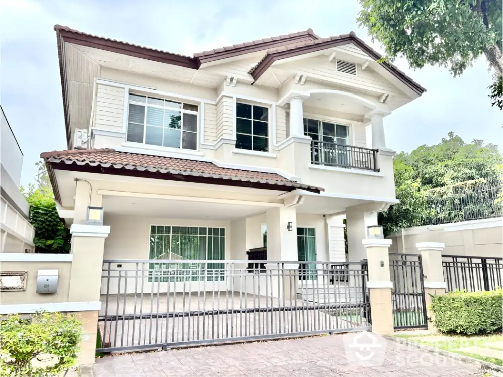 Elegant two-story house with modern design and spacious driveway in a serene neighborhood.