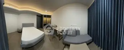 Modern bedroom with sleek furniture and ambient lighting