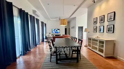Spacious living room with dining area and modern decor