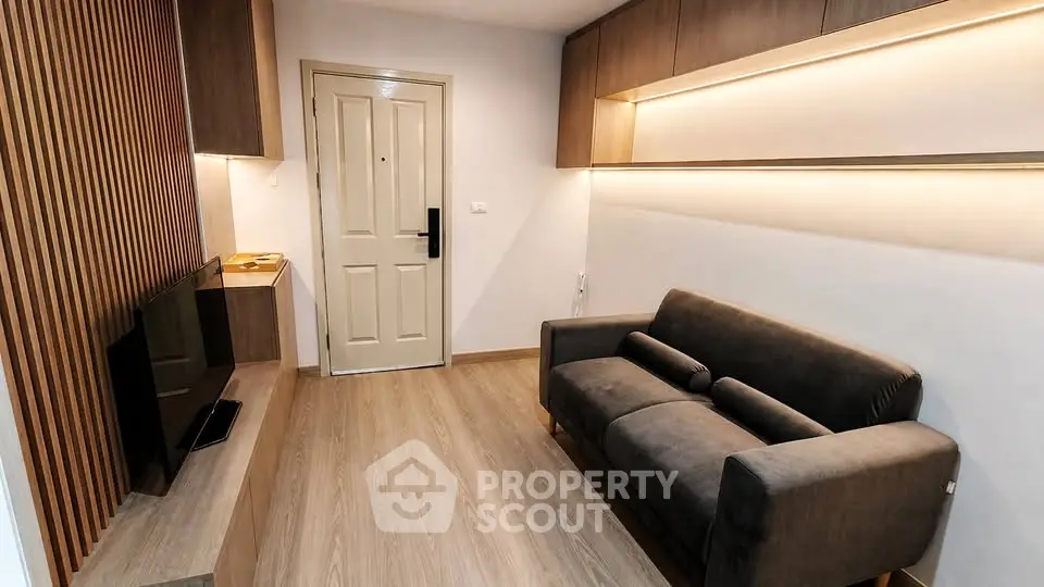 Modern living room with sleek design and cozy sofa in stylish apartment.