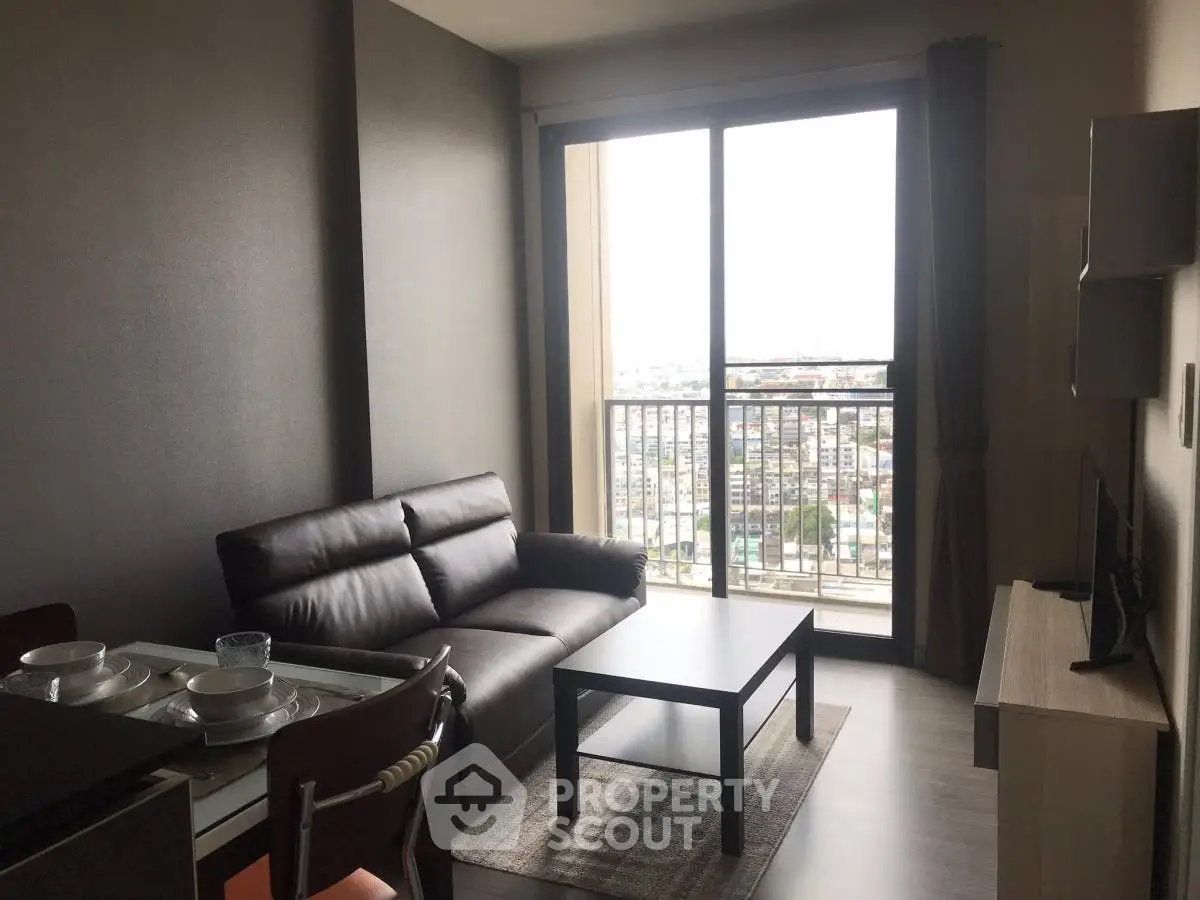 Modern living room with city view, sleek furniture, and natural light.