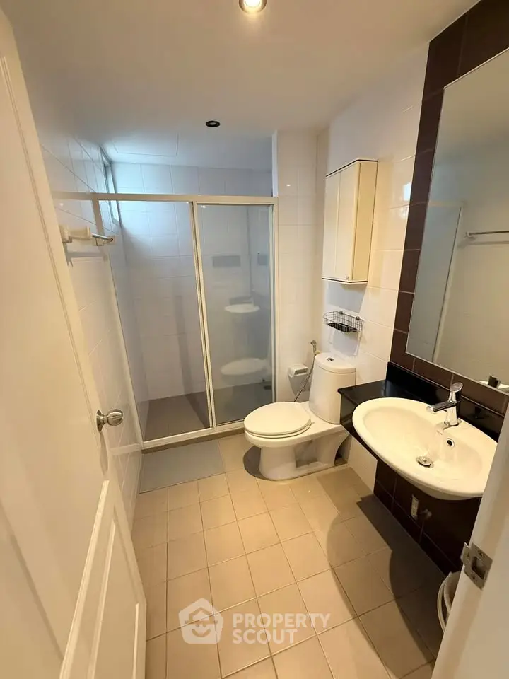 Modern bathroom with glass shower and sleek fixtures