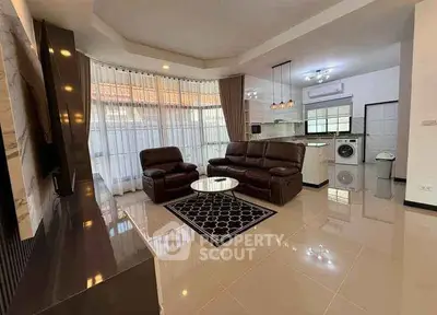 Spacious modern living room with open kitchen and sleek furnishings