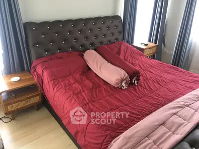 Luxurious bedroom with elegant red bedding and stylish headboard