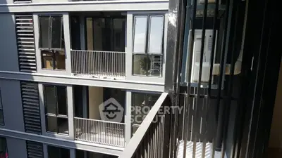 Modern apartment building with sleek balconies and large windows