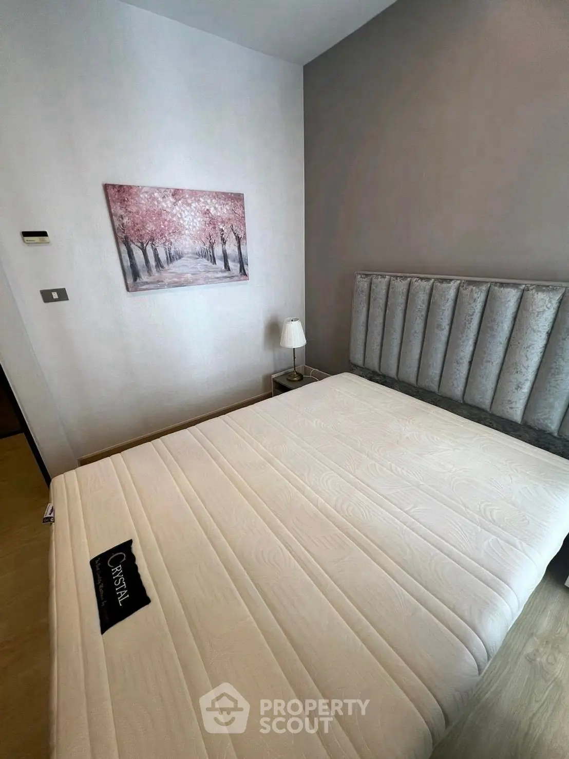 Modern bedroom with stylish decor and comfortable bed in a contemporary apartment.