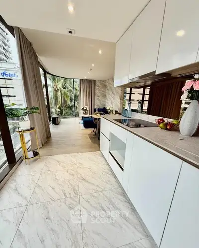 Luxurious open-layout kitchen with modern design and stunning view, perfect for contemporary living.