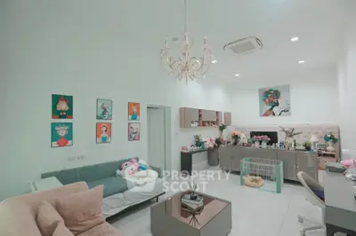 Chic living room with modern decor, plush seating, and elegant chandelier, perfect for stylish urban living.