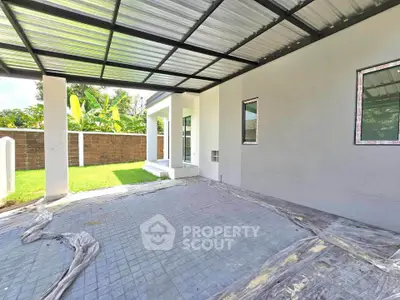 Modern covered patio with garden view in a contemporary home
