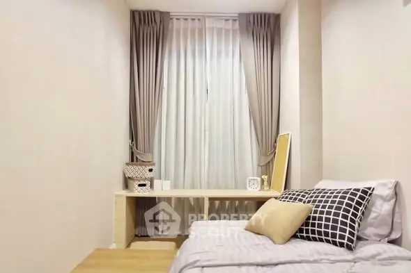 Cozy bedroom with stylish decor and natural light