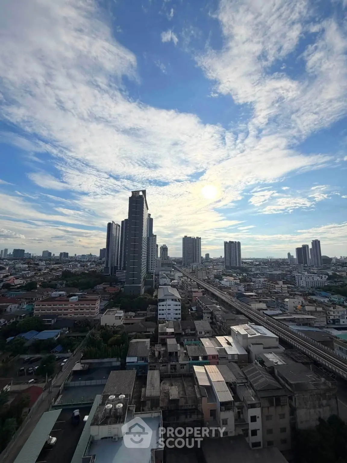 Stunning cityscape view with high-rise buildings under a vibrant sky, perfect for urban living enthusiasts.