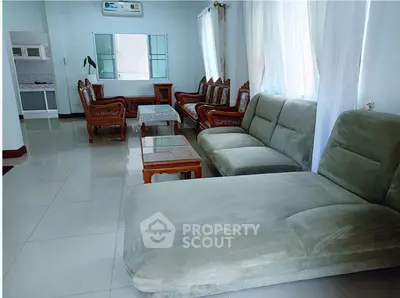 Spacious living room with elegant furniture and ample natural light