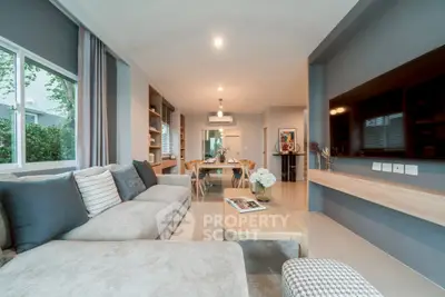 Spacious modern living room with elegant decor and large windows